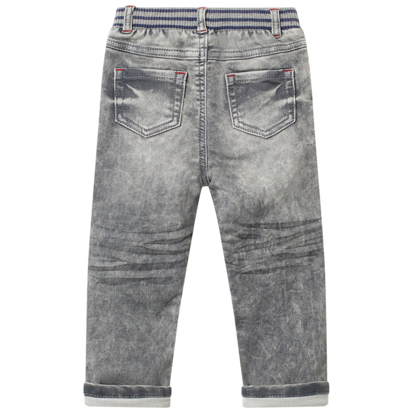 Jean effetused à badge et taille élastiquée 