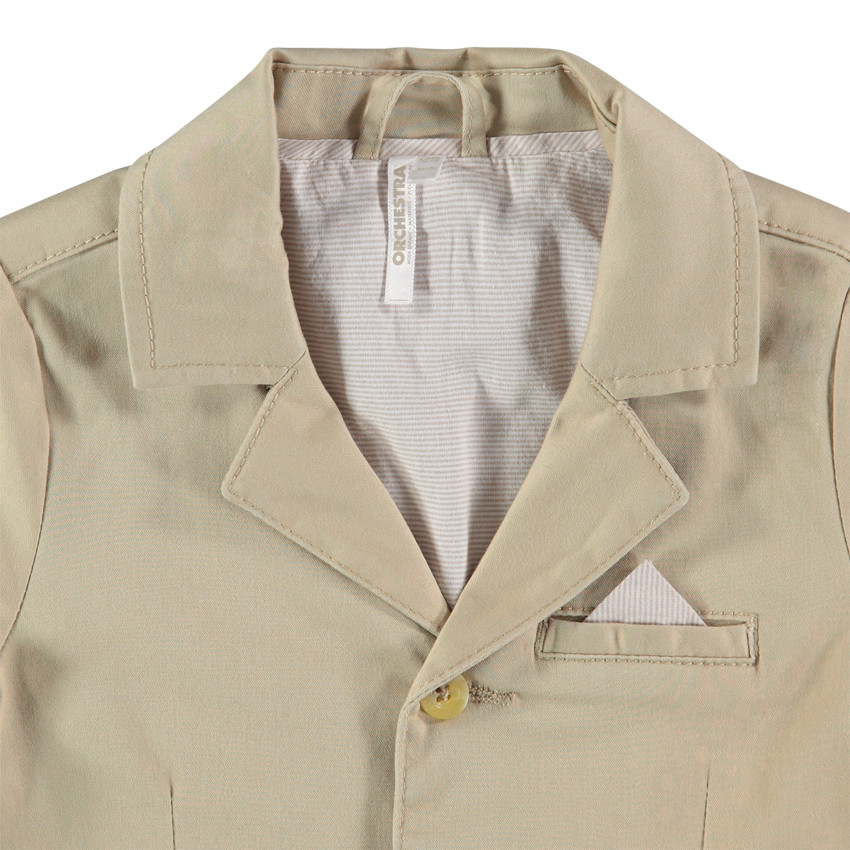 Μονόχρωμο μπλέιζερ με ριγέ φόδρα και τσέπες 