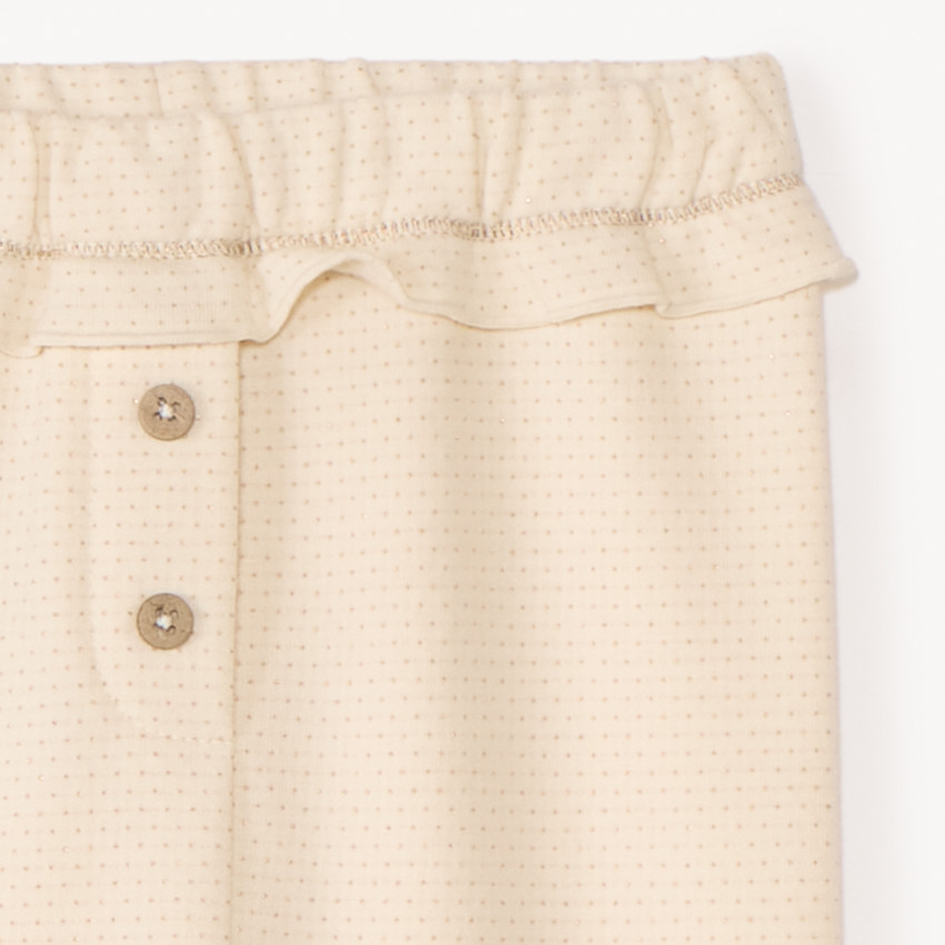 Κοντά παντελόνια με πολυάριθμα σχέδια για κορίτσι μωρού. 