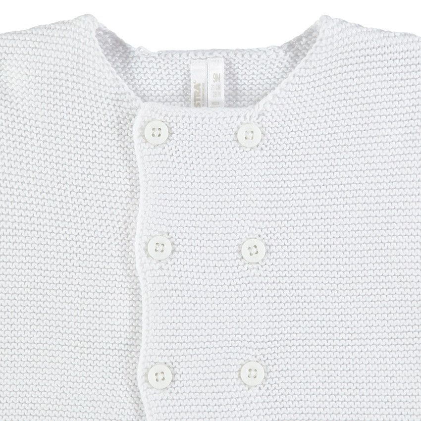 Μονόχρωμη πλεκτή ζακέτα με διπλό κούμπωμα 