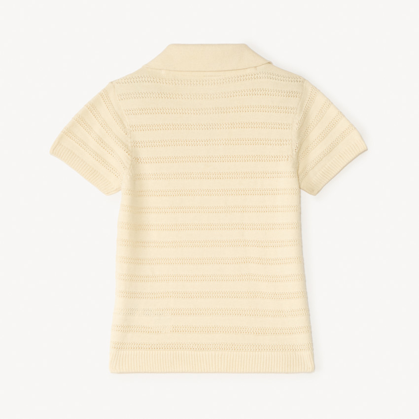 Πολό με κοντά μανίκια και φαντασία σε πλέξη για μωρό αγόρι. 