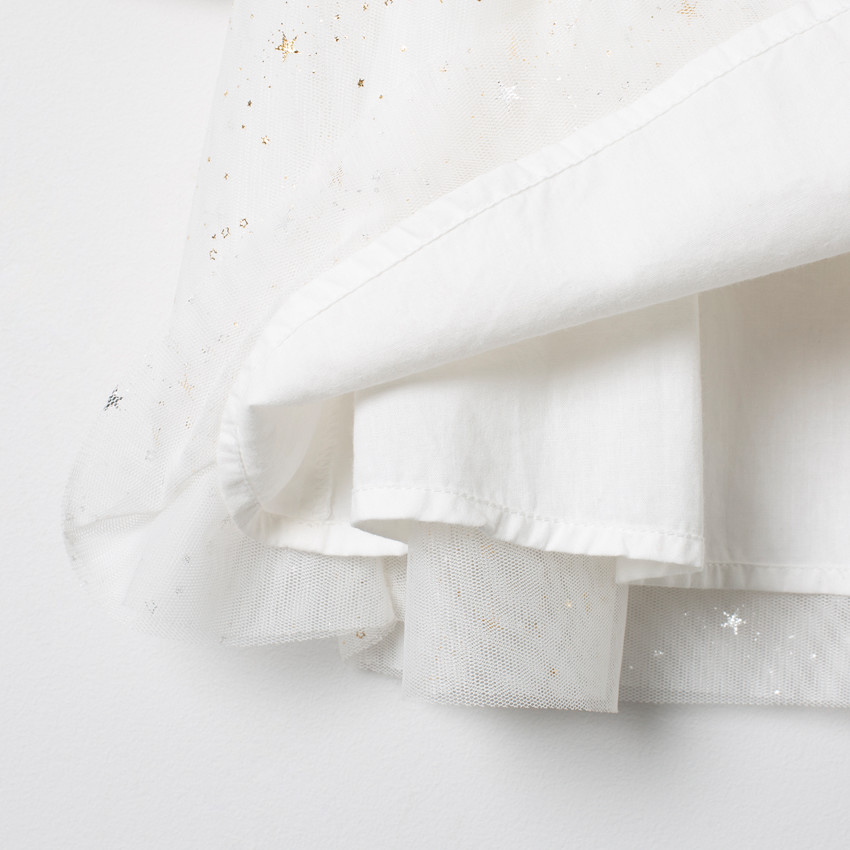 Robe manches longues à tulle et étoiles dorées  