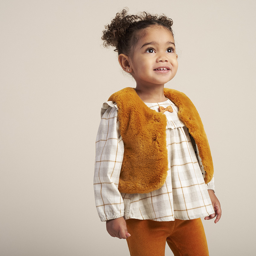 Gilet sans manches en fausse fourrure doublé jersey à pois 