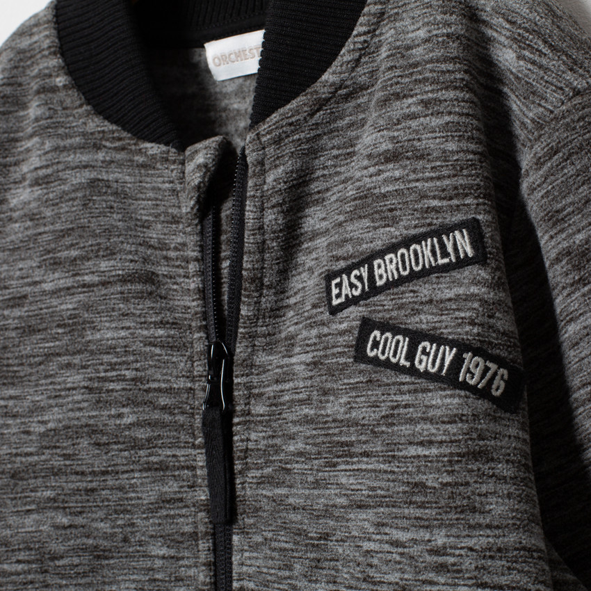 Gilet en polaire chinée à zip et message printé au dos 