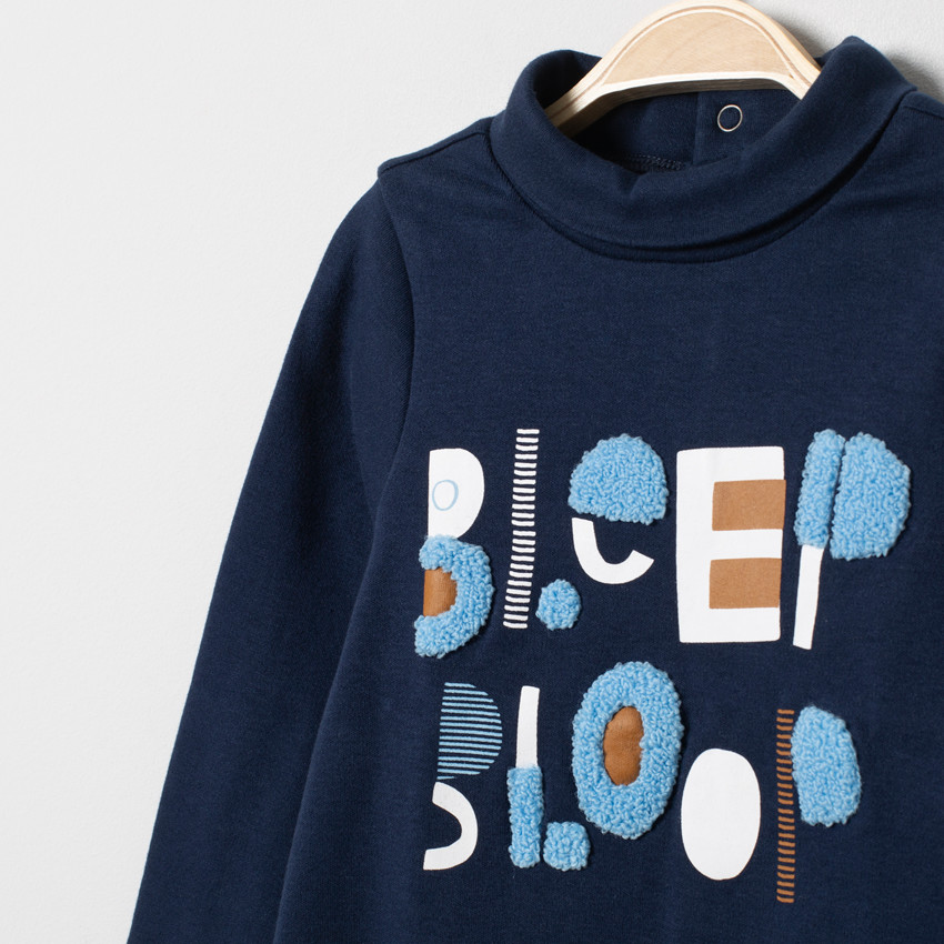 Sous-pull col roulé à inscription en bouclette  