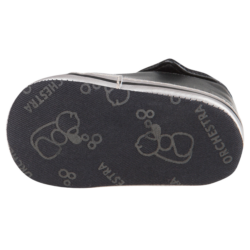 Babies noires montantes à revers et lacets 