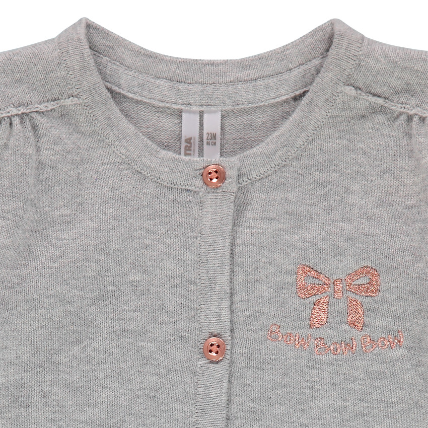 Gilet en tricot chiné à noeud brodé 