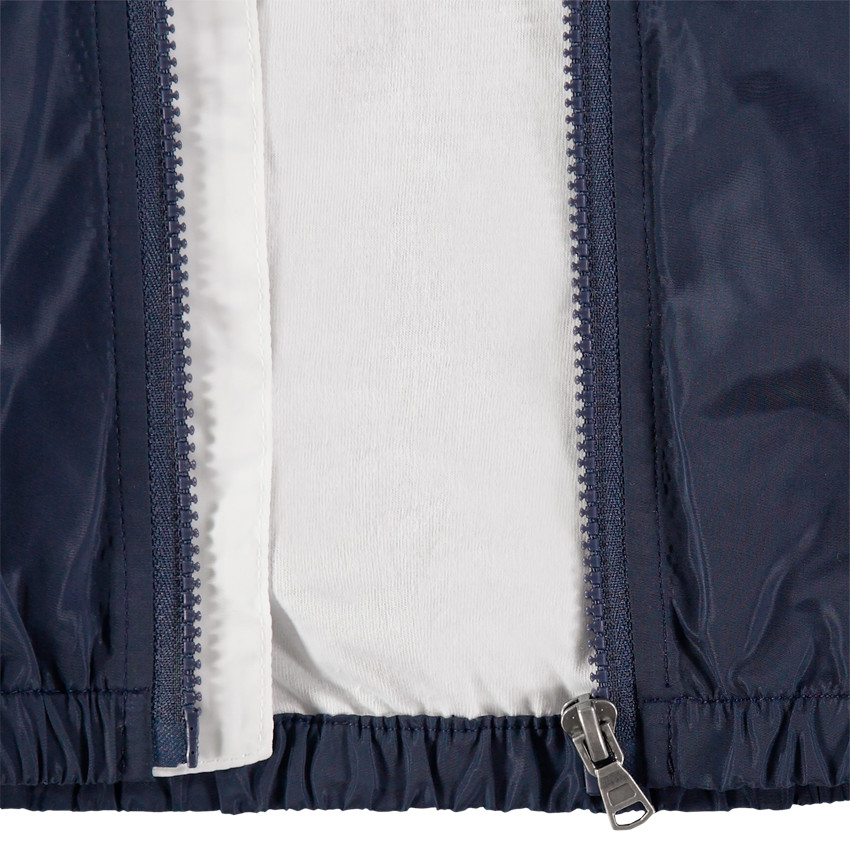 Τρίχρωμο αντιανεμικό με επένδυση ζέρσεϊ και τσέπες με φερμουάρ  