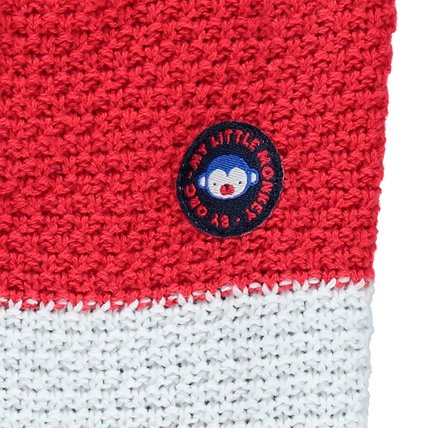 Ζακέτα σε χοντρή πλέξη με τσέπες και σήμα από καουτσούκ 